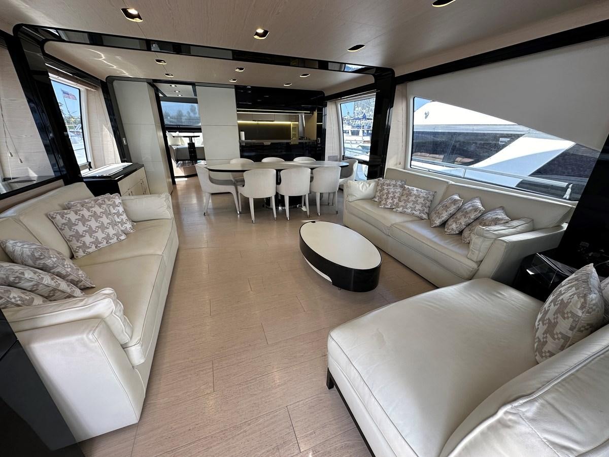 a living room with a large window aboard SLINGSHOT Yacht for Sale