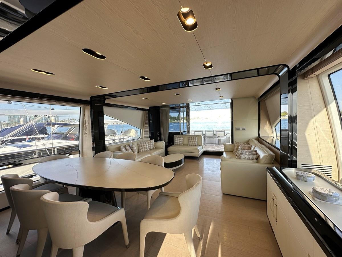 a living room with a large window aboard SLINGSHOT Yacht for Sale