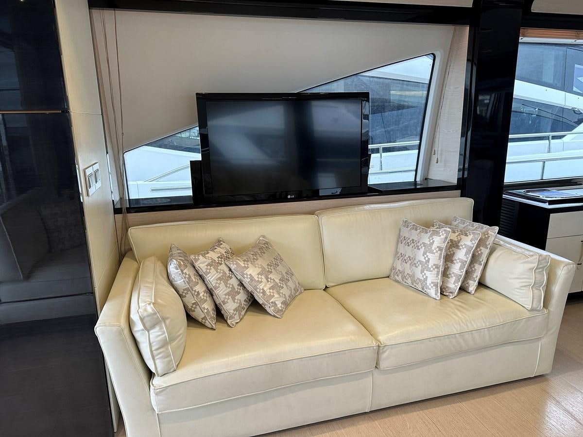 a couch in a living room aboard SLINGSHOT Yacht for Sale