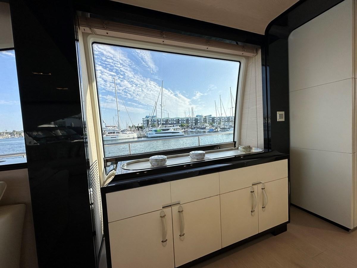 a window with a view of a city aboard SLINGSHOT Yacht for Sale
