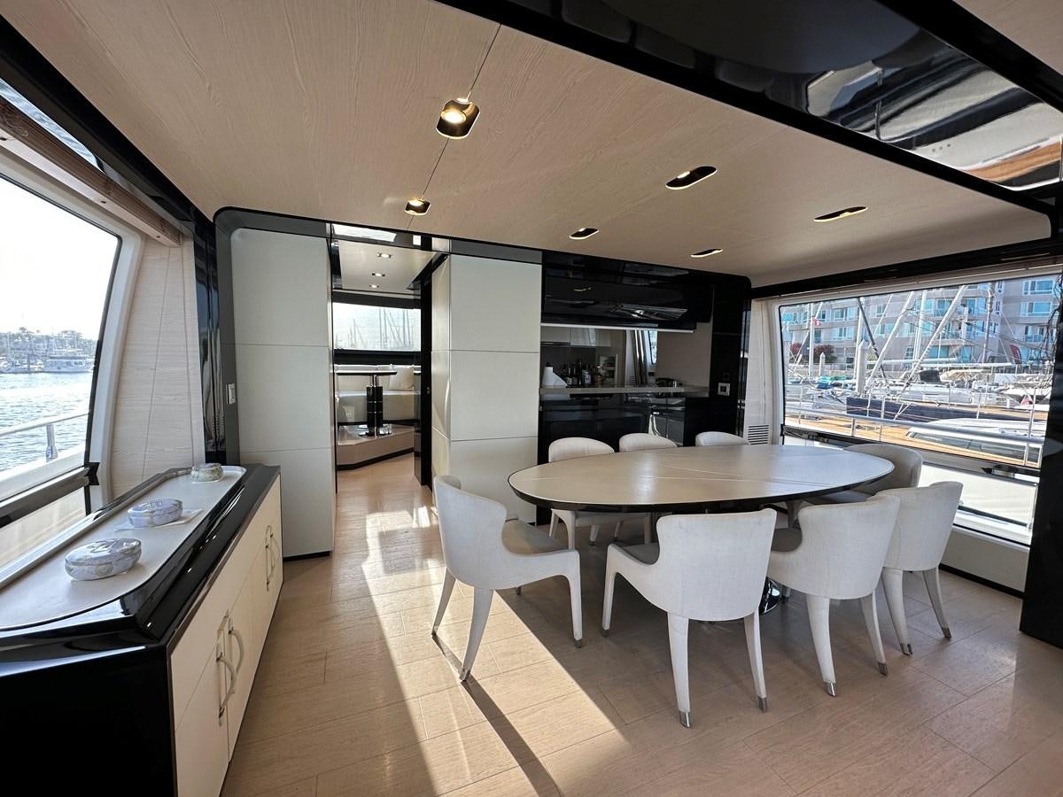 a kitchen and dining area aboard SLINGSHOT Yacht for Sale