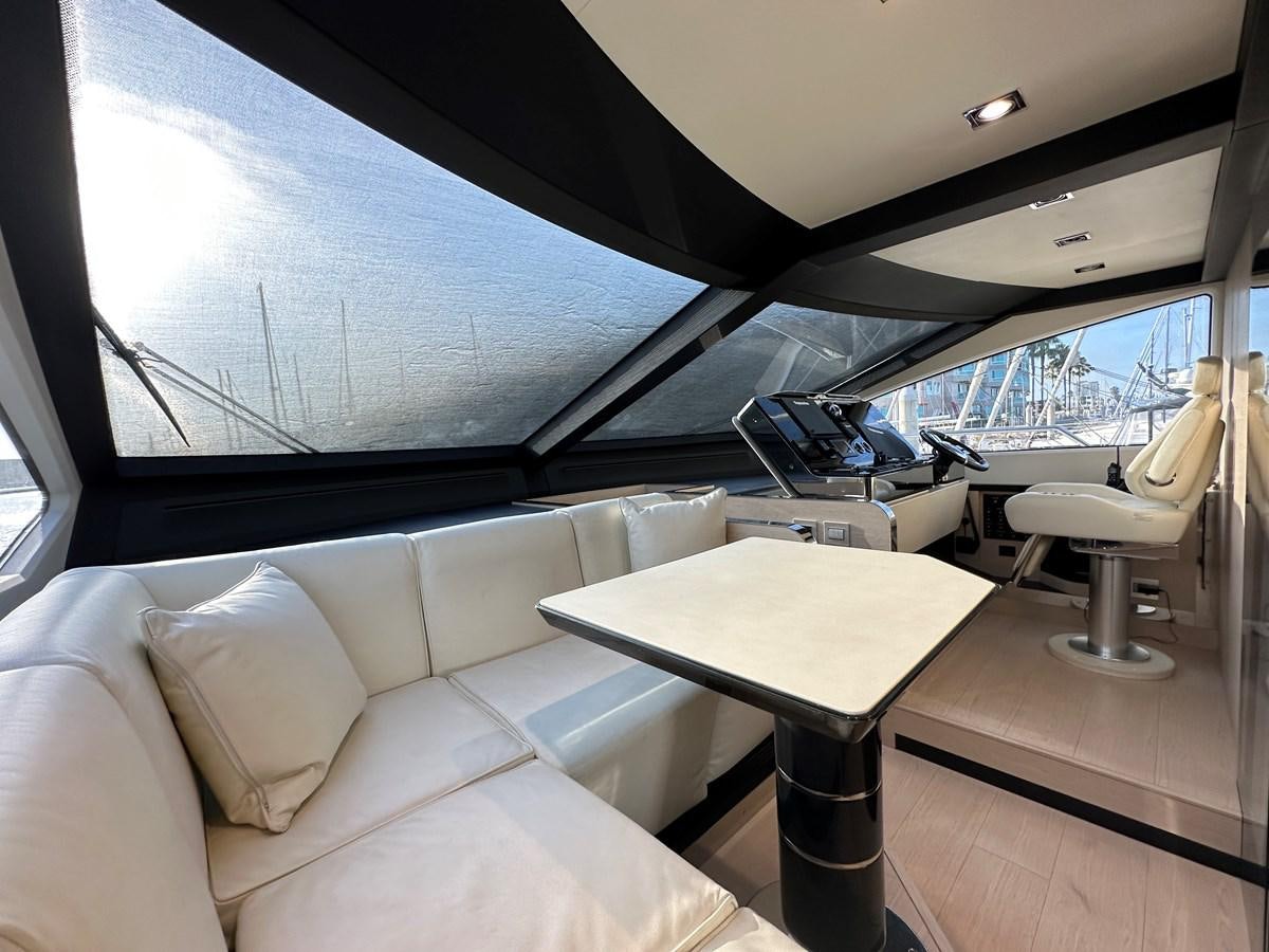 a boat with a table and chairs aboard SLINGSHOT Yacht for Sale