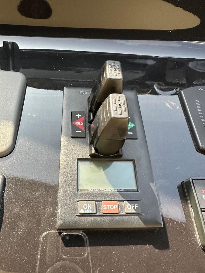 a cell phone on a table aboard SLINGSHOT Yacht for Sale