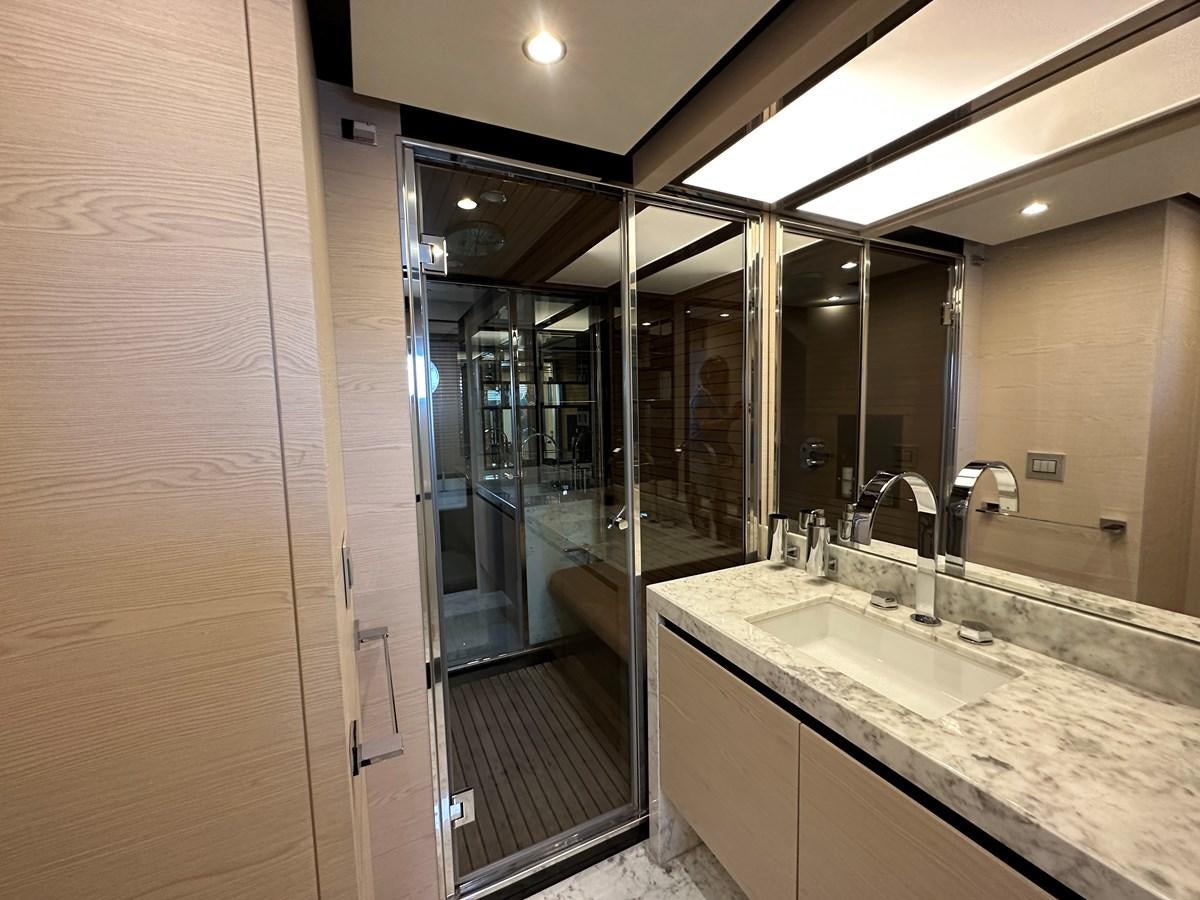 a bathroom with a large mirror aboard SLINGSHOT Yacht for Sale