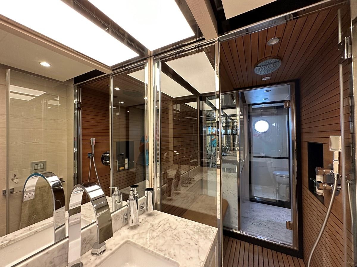 a bathroom with glass walls aboard SLINGSHOT Yacht for Sale