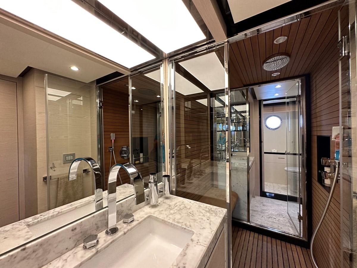 a bathroom with a large mirror aboard SLINGSHOT Yacht for Sale