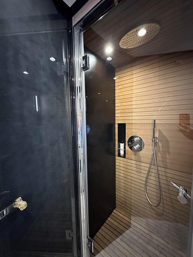 a shower with a mirror aboard SLINGSHOT Yacht for Sale