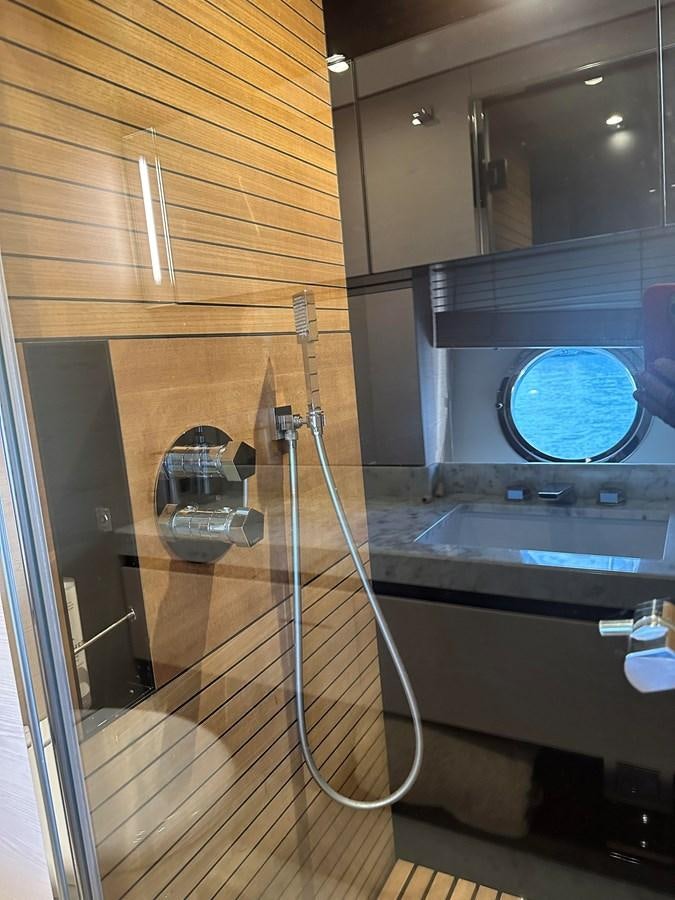 a shower unit with a mirror aboard SLINGSHOT Yacht for Sale
