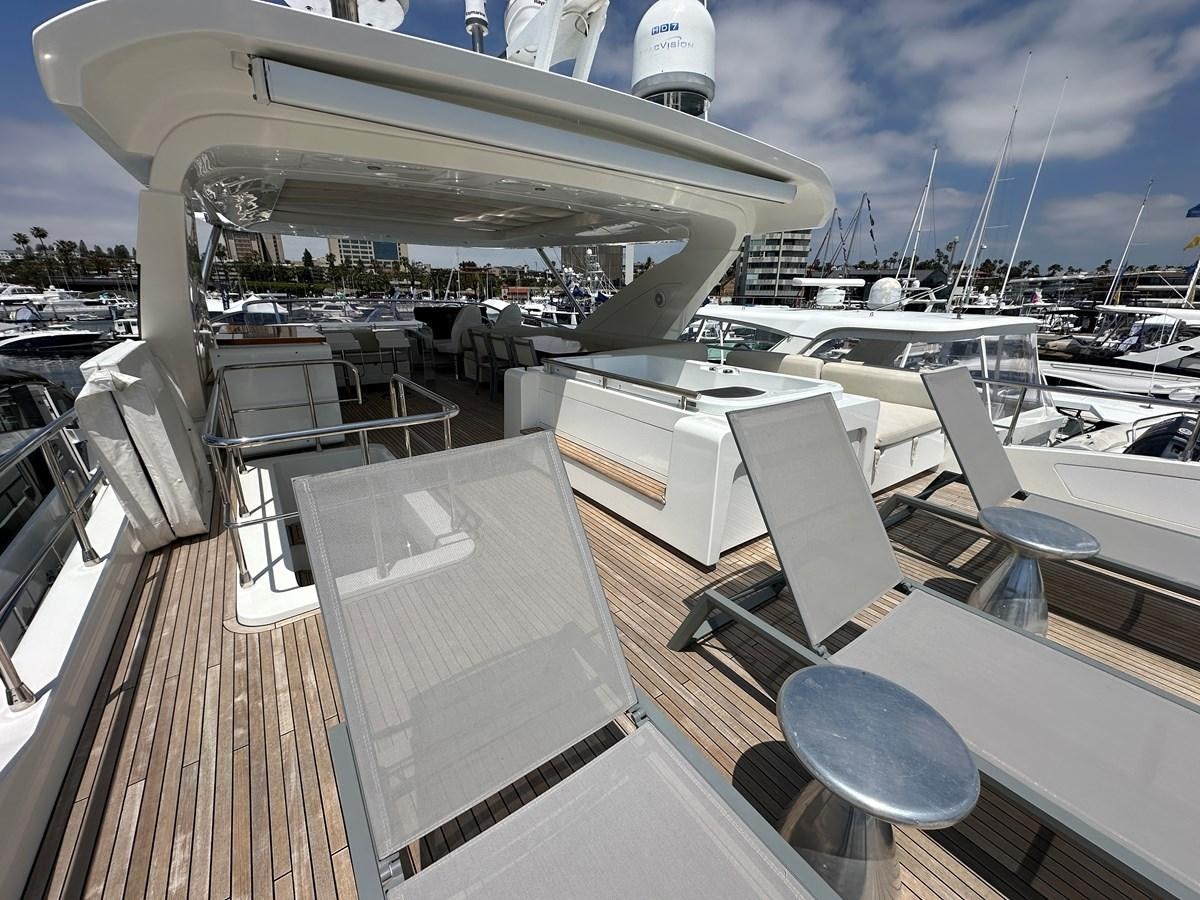 a deck with a deck and a view of the water aboard SLINGSHOT Yacht for Sale