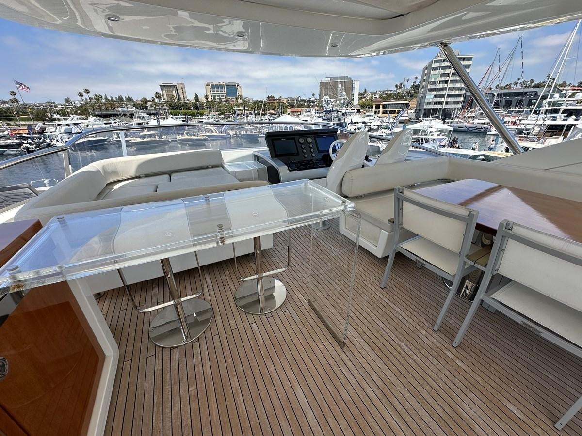 a deck with a deck overlooking a city aboard SLINGSHOT Yacht for Sale