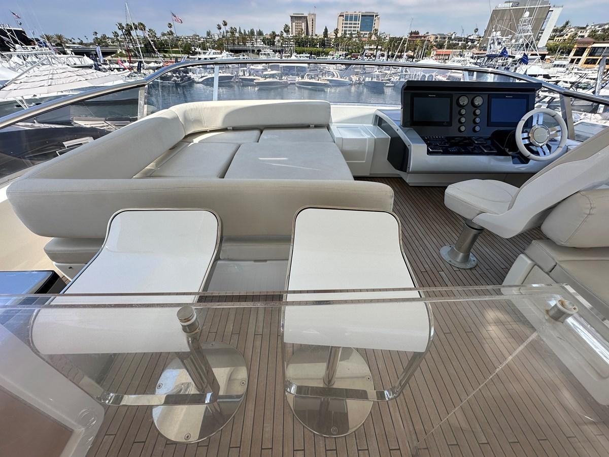 a deck with a view of a city and a large body of water aboard SLINGSHOT Yacht for Sale