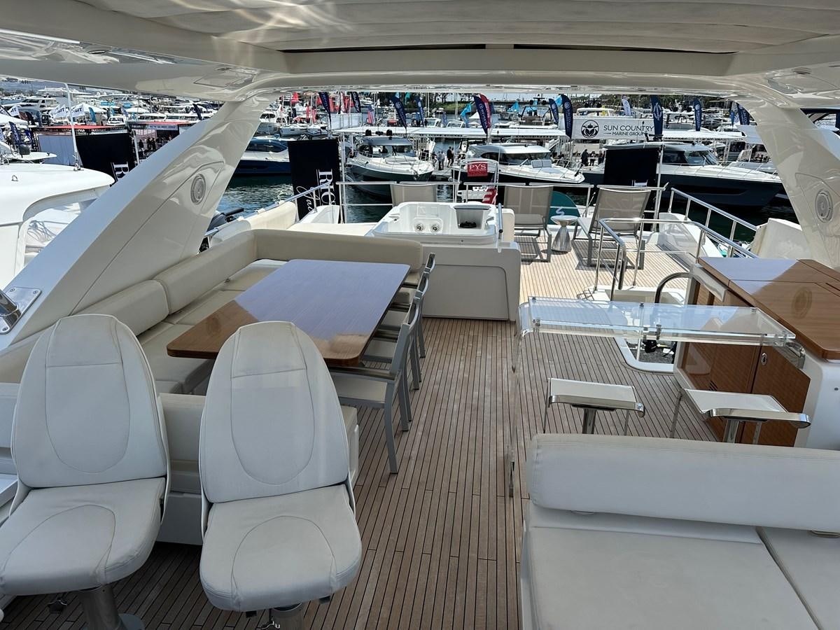a boat with tables and chairs aboard SLINGSHOT Yacht for Sale
