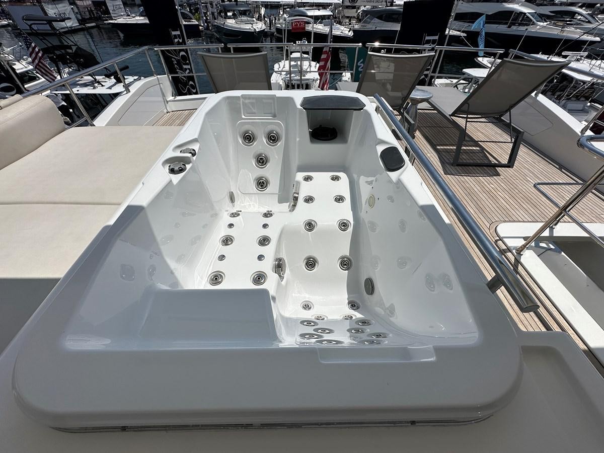 a white rectangular object with a black circle on it aboard SLINGSHOT Yacht for Sale