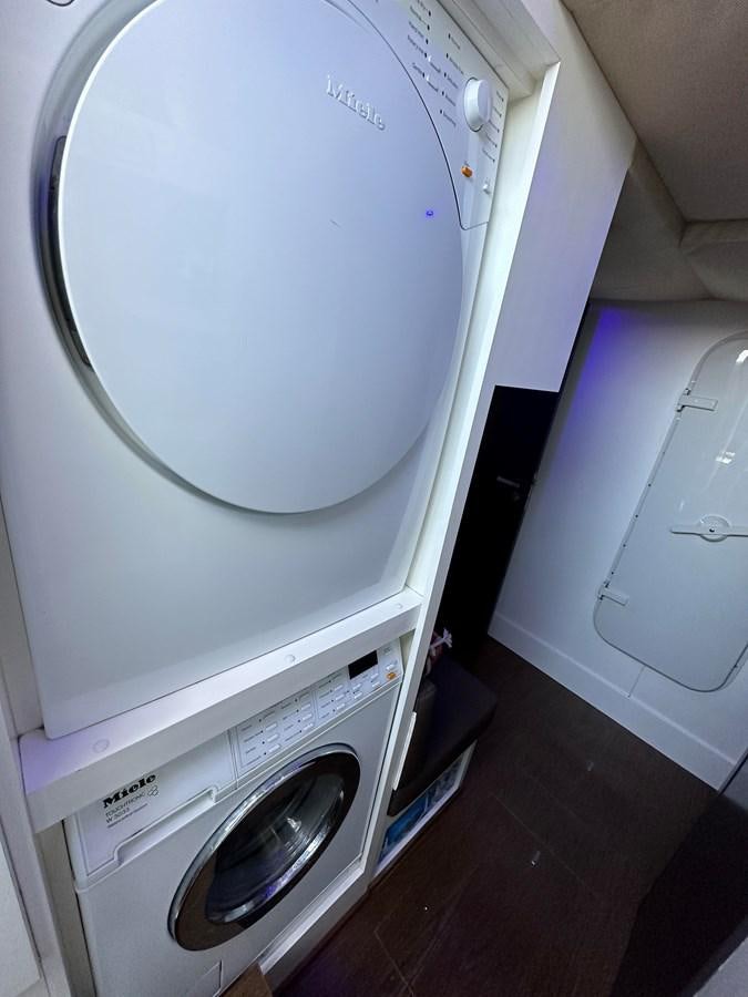 a white washing machine aboard SLINGSHOT Yacht for Sale