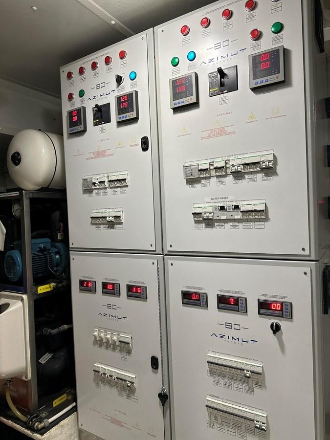 a white machine with buttons and switches aboard SLINGSHOT Yacht for Sale