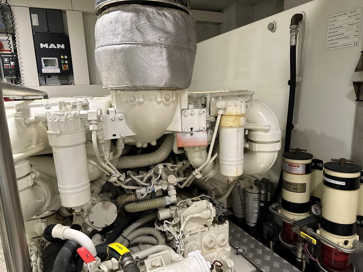 a machine with a large metal cylinder aboard SLINGSHOT Yacht for Sale