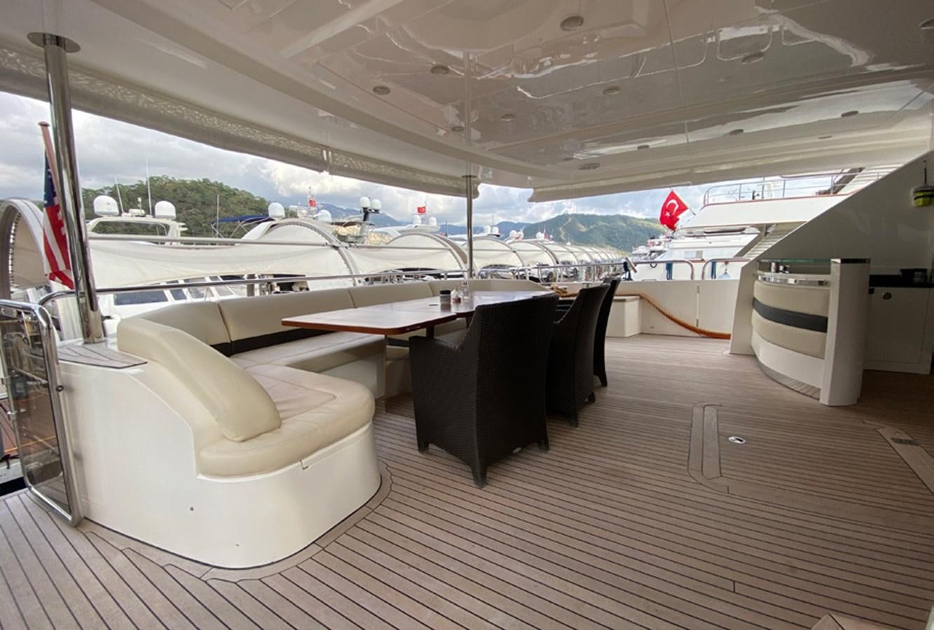 a room with a table and chairs aboard SEZI MEGA Yacht for Sale