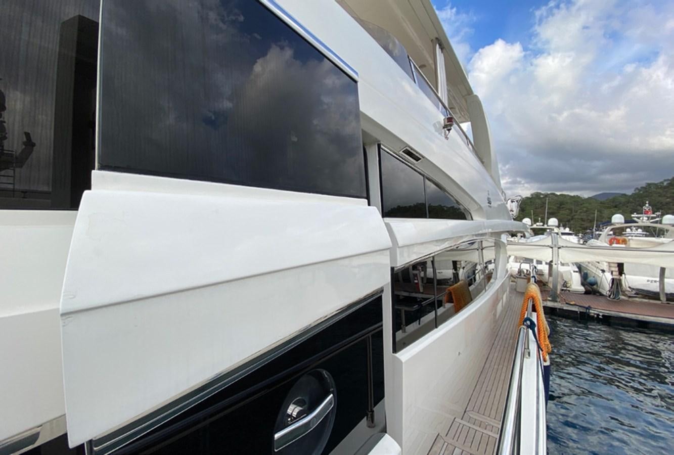 a large white boat on a dock aboard SEZI MEGA Yacht for Sale