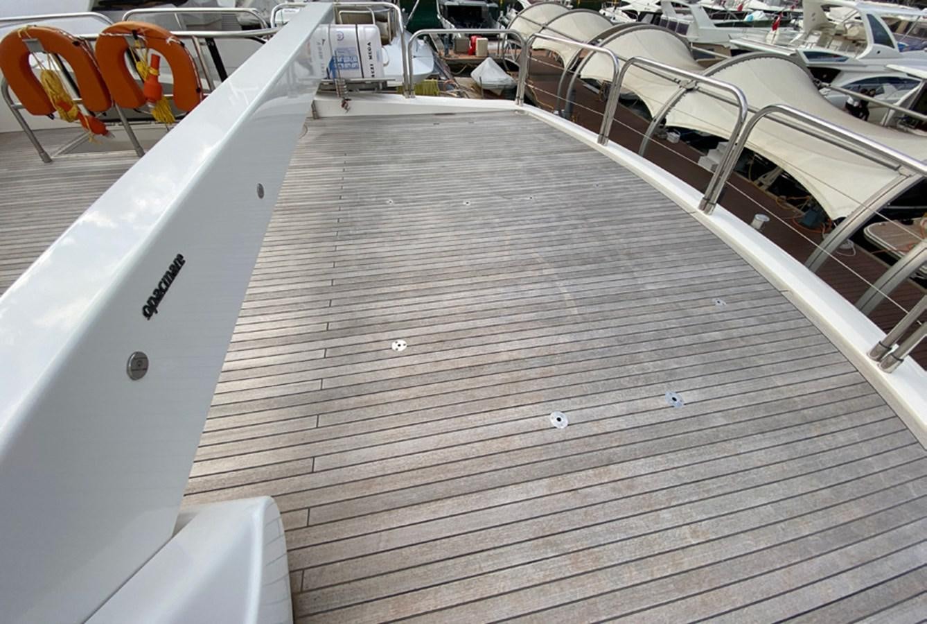 a wooden deck with white boards aboard SEZI MEGA Yacht for Sale