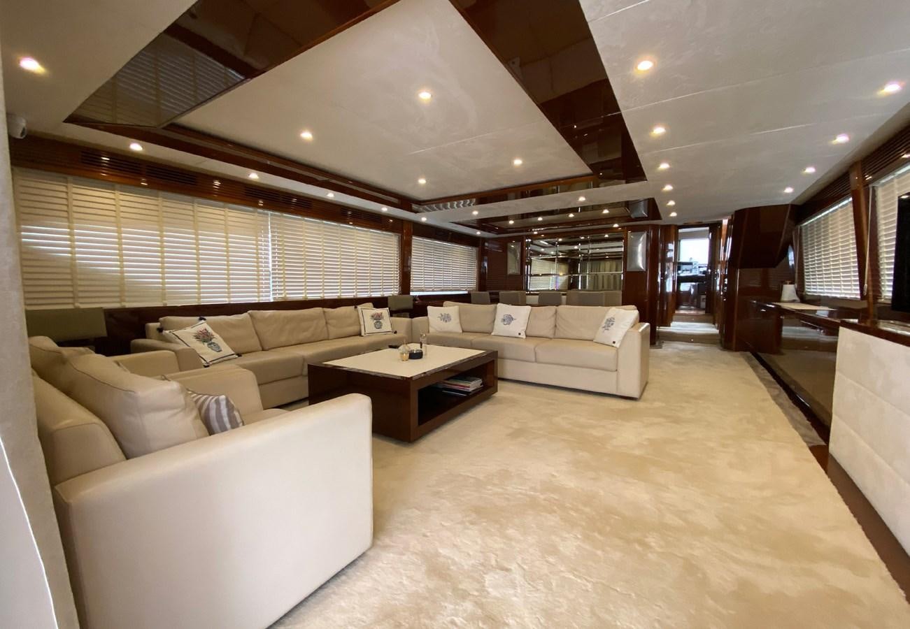 a living room with a couch and a table aboard SEZI MEGA Yacht for Sale