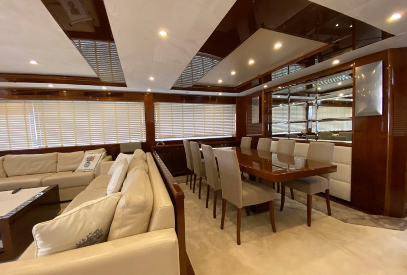 a room with a table and couches aboard SEZI MEGA Yacht for Sale