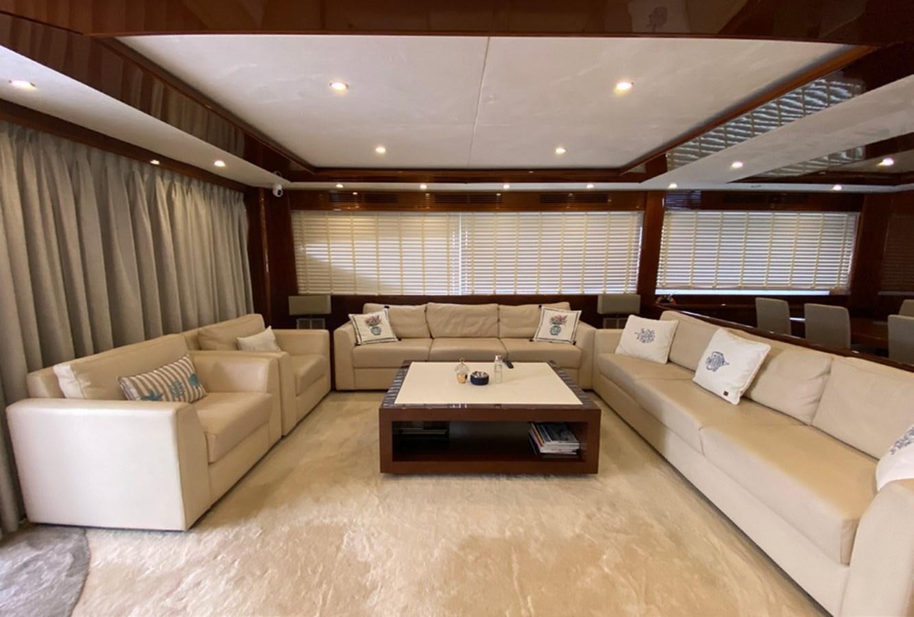 a living room with a couch and a table aboard SEZI MEGA Yacht for Sale