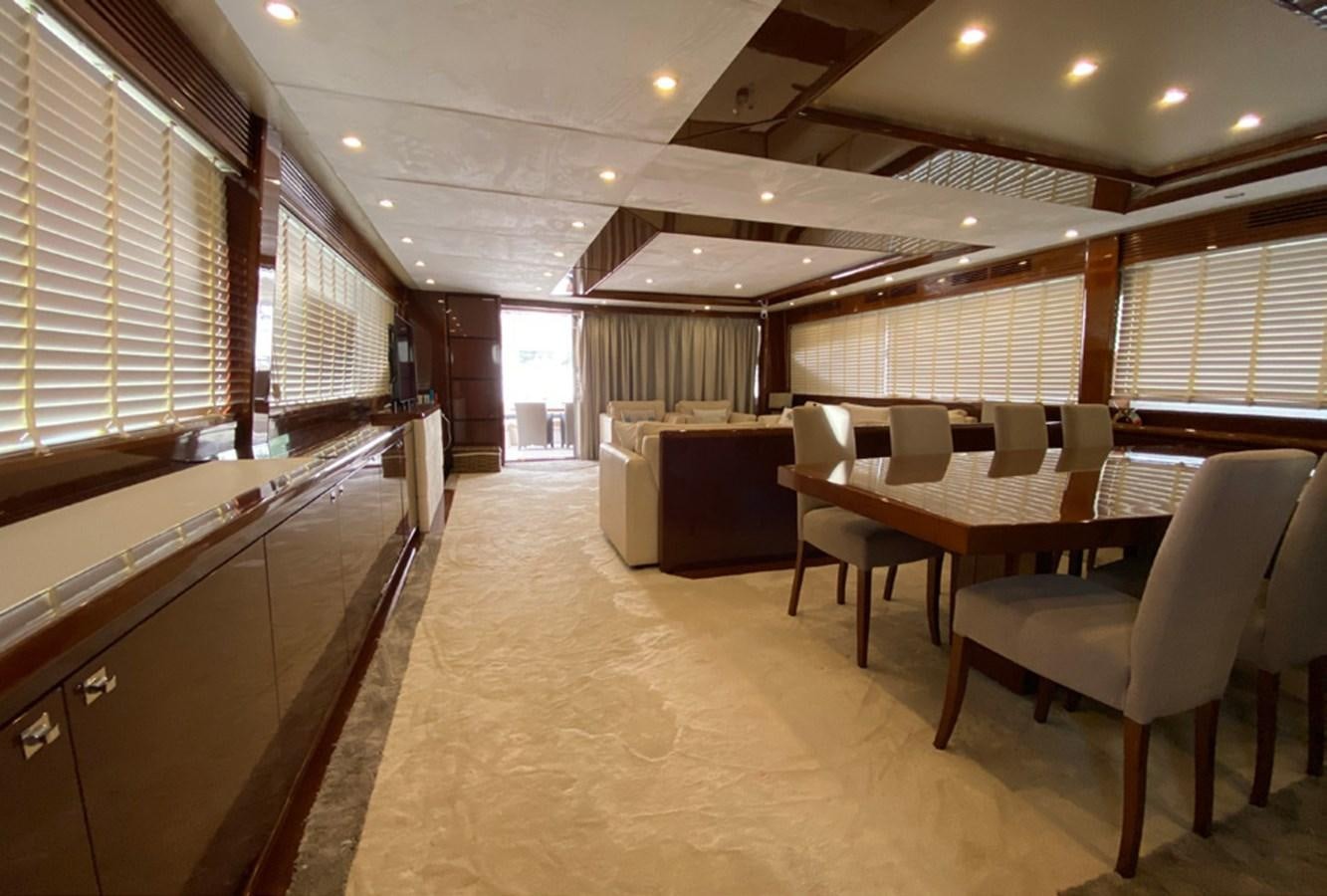 a room with tables and chairs aboard SEZI MEGA Yacht for Sale