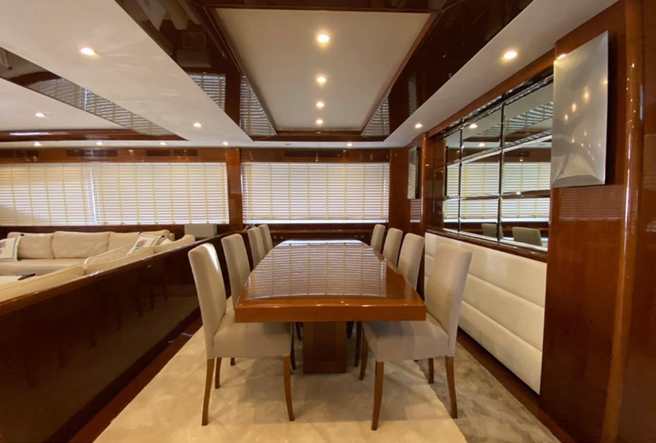 a room with a table and chairs aboard SEZI MEGA Yacht for Sale