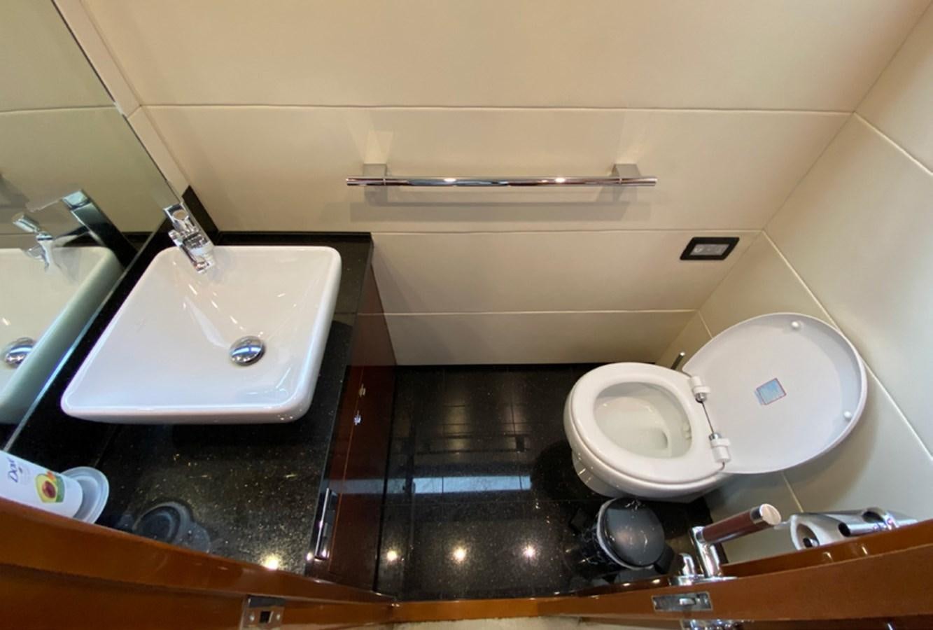 a bathroom with a toilet and sink aboard SEZI MEGA Yacht for Sale
