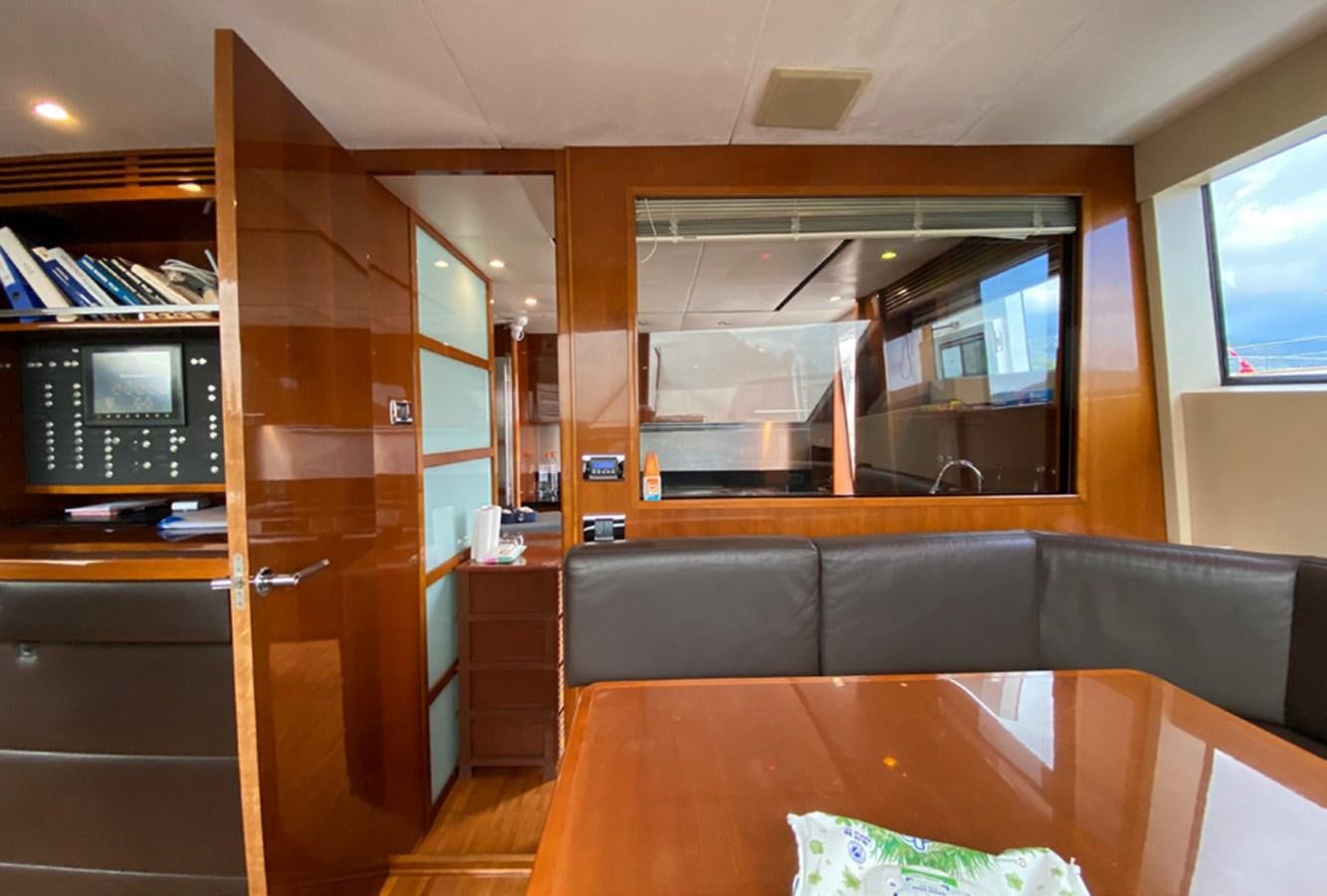 a living room with a couch and tv aboard SEZI MEGA Yacht for Sale