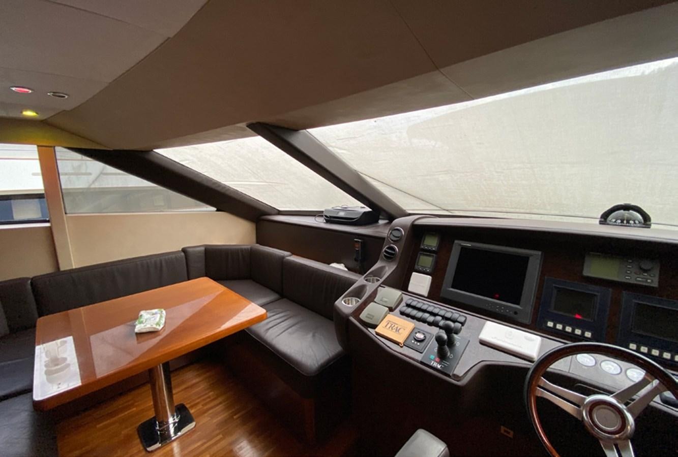 a room with a couch and a desk with computers aboard SEZI MEGA Yacht for Sale