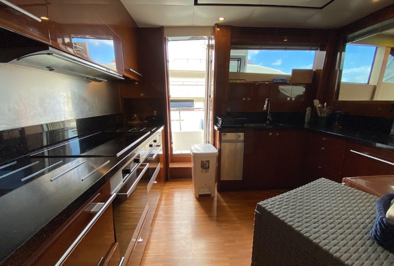 a kitchen with a large window aboard SEZI MEGA Yacht for Sale