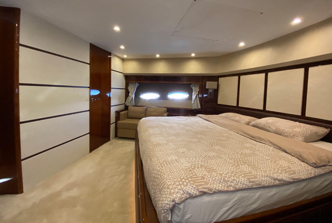 a room with a bed and a television aboard SEZI MEGA Yacht for Sale