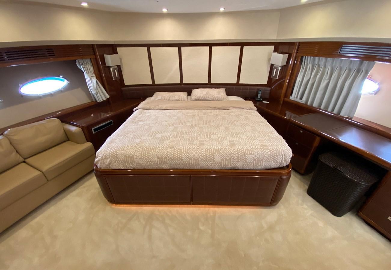 a room with a bed and a couch aboard SEZI MEGA Yacht for Sale
