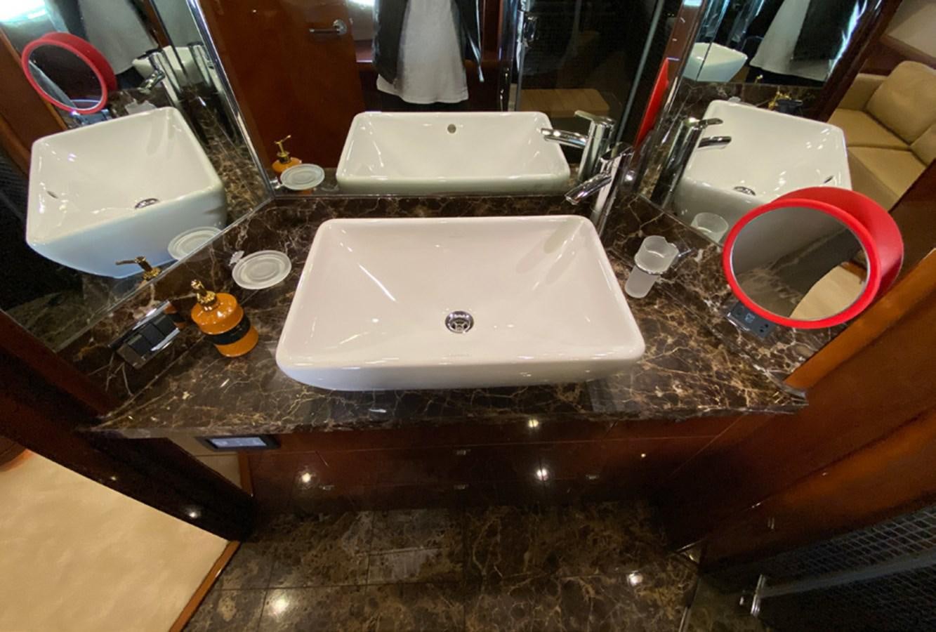 a white rectangular object on a wooden surface aboard SEZI MEGA Yacht for Sale