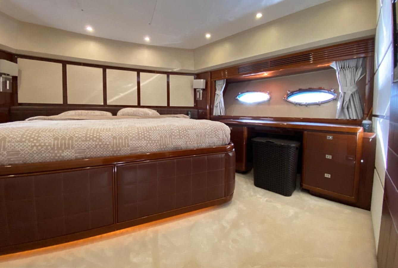 a bedroom with a bed and a television aboard SEZI MEGA Yacht for Sale