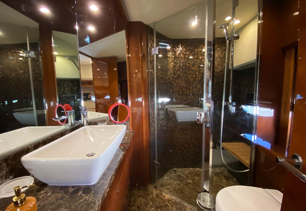 a bathroom with a large glass shower aboard SEZI MEGA Yacht for Sale