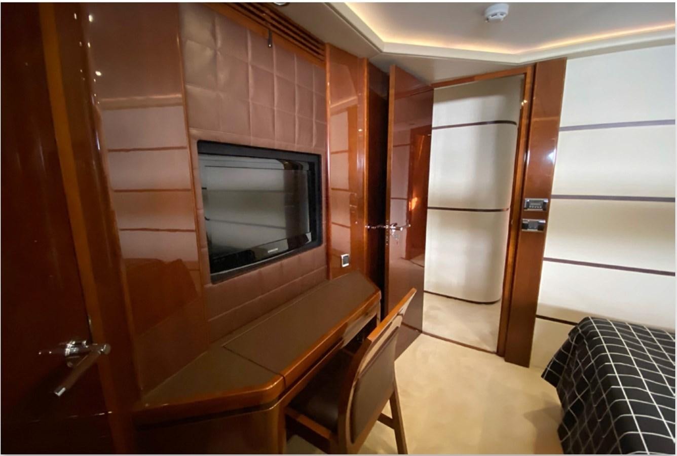 a room with a bed and a television aboard SEZI MEGA Yacht for Sale
