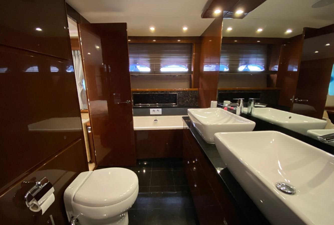 a bathroom with a sink toilet and bathtub aboard SEZI MEGA Yacht for Sale