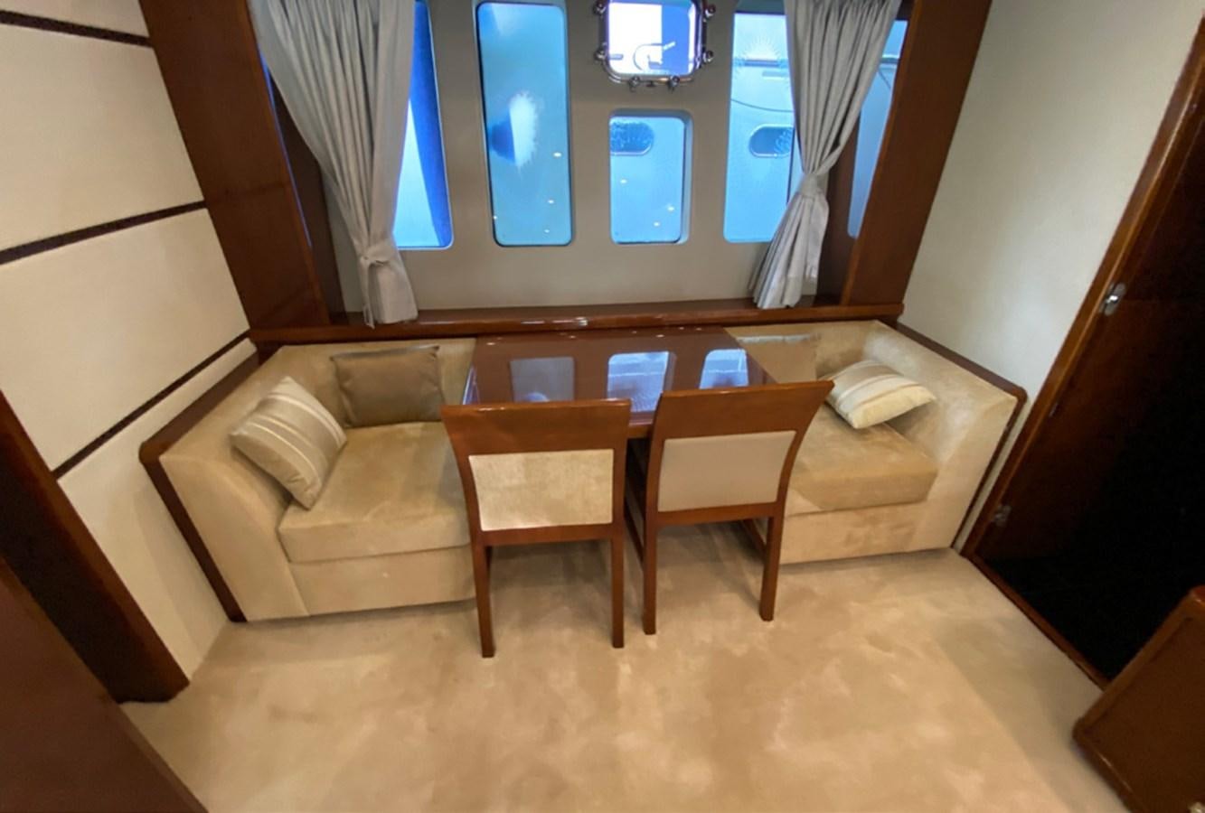 a room with a couch and a table aboard SEZI MEGA Yacht for Sale