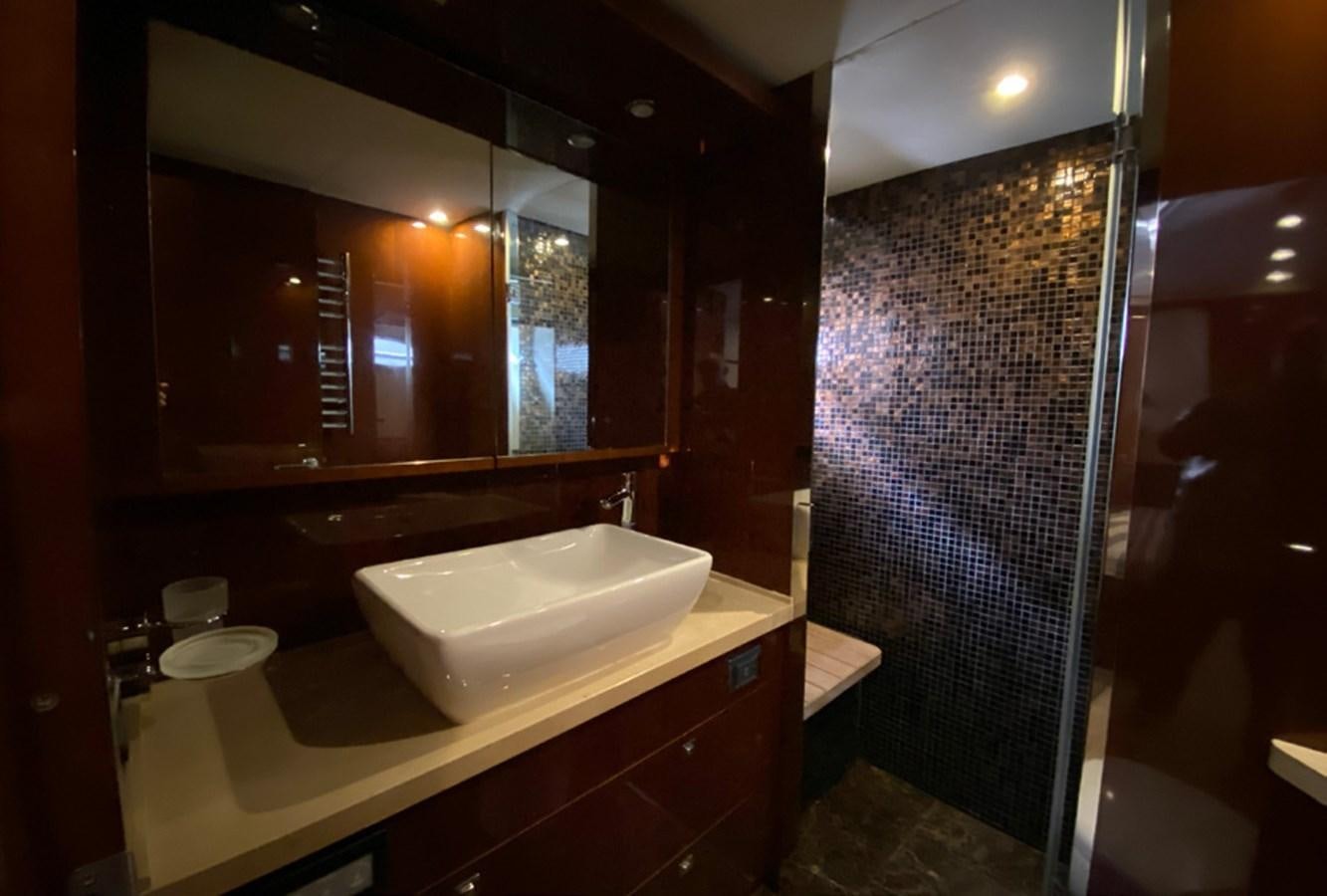 a bathroom with a sink and a mirror aboard SEZI MEGA Yacht for Sale
