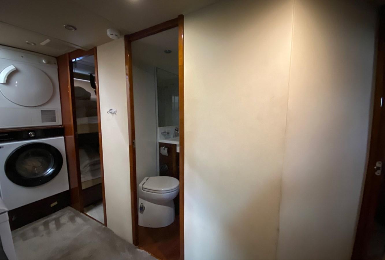 a washer and dryer in a bathroom aboard SEZI MEGA Yacht for Sale