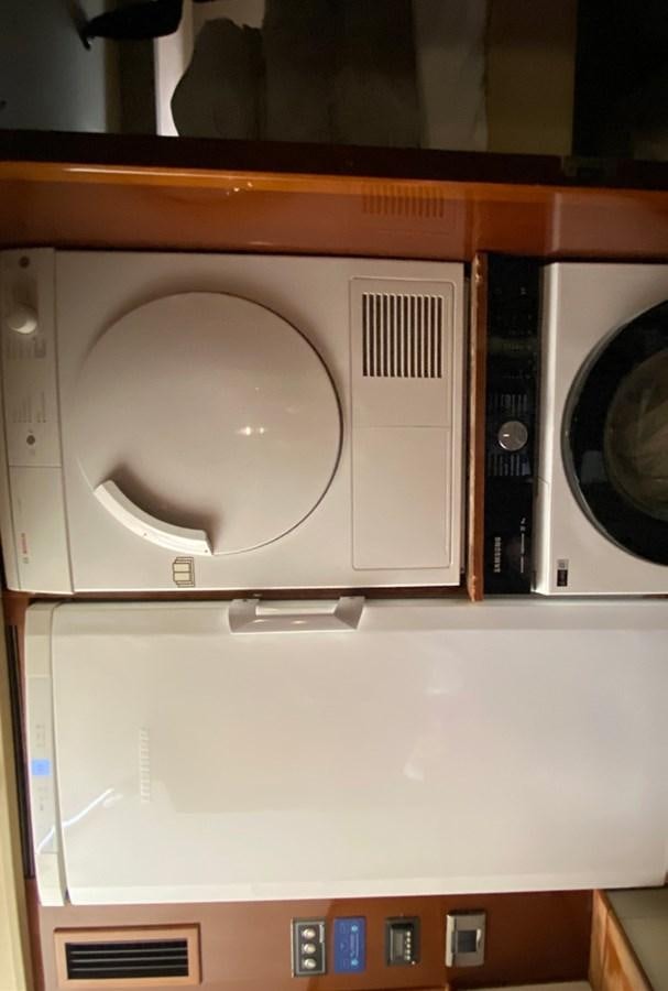 a white washing machine aboard SEZI MEGA Yacht for Sale