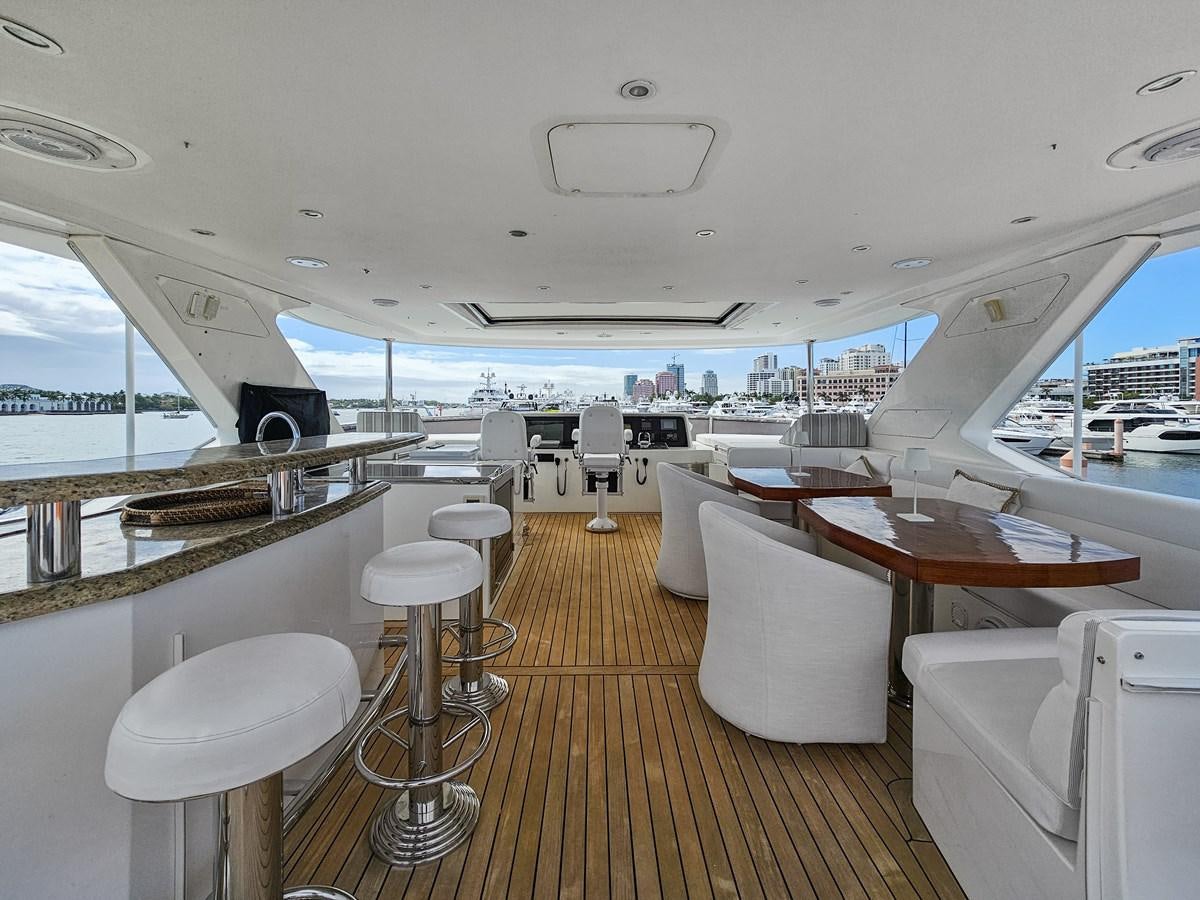 a boat with tables and chairs aboard O A Yacht for Sale