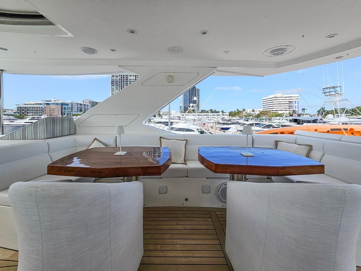 a room with a view of the water and a city aboard O A Yacht for Sale