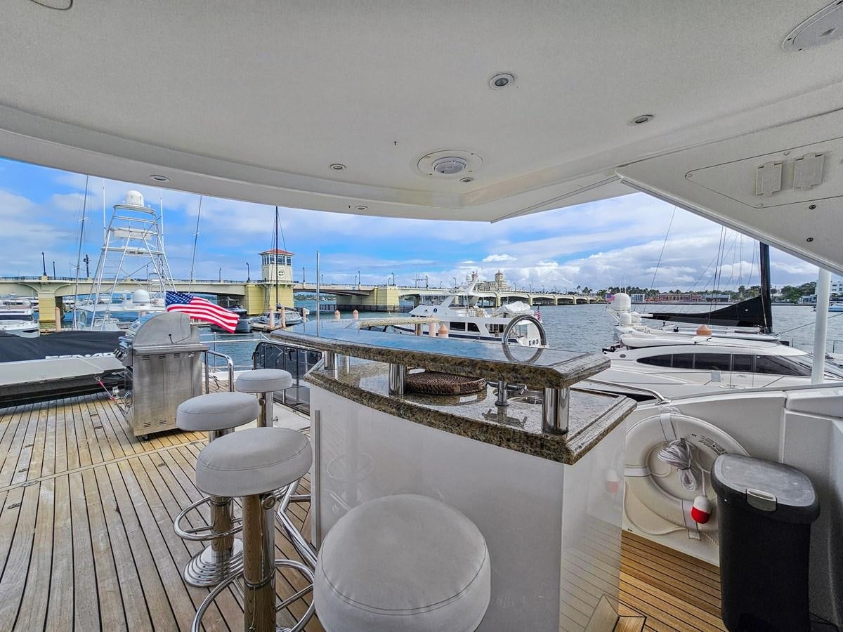 a boat with a deck and a deck and a deck with a view of the water aboard O A Yacht for Sale