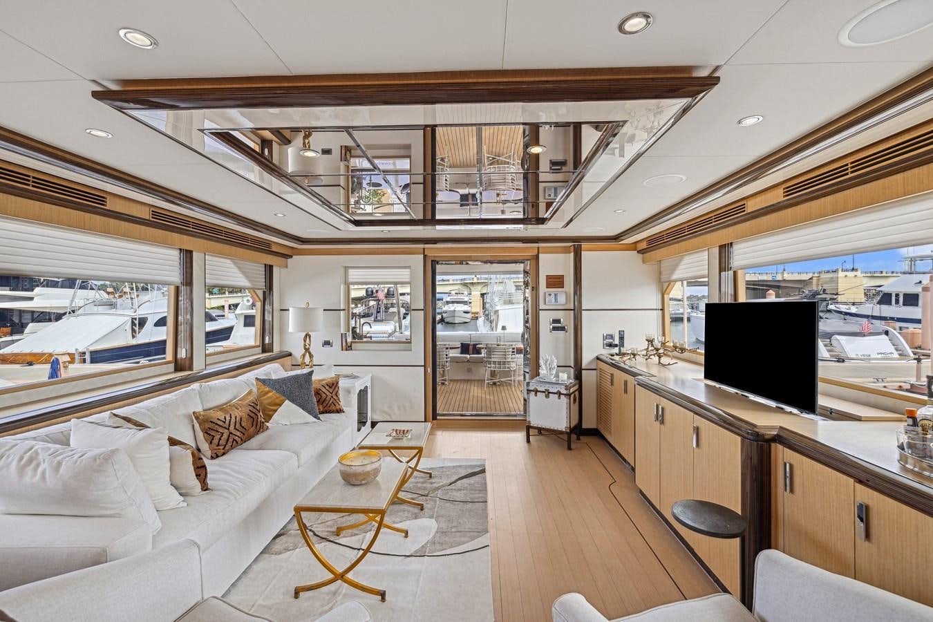 a living room with a large window aboard O A Yacht for Sale