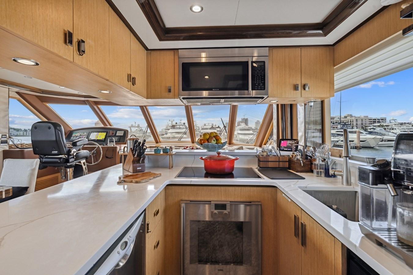 a kitchen with a microwave oven and a stove aboard O A Yacht for Sale