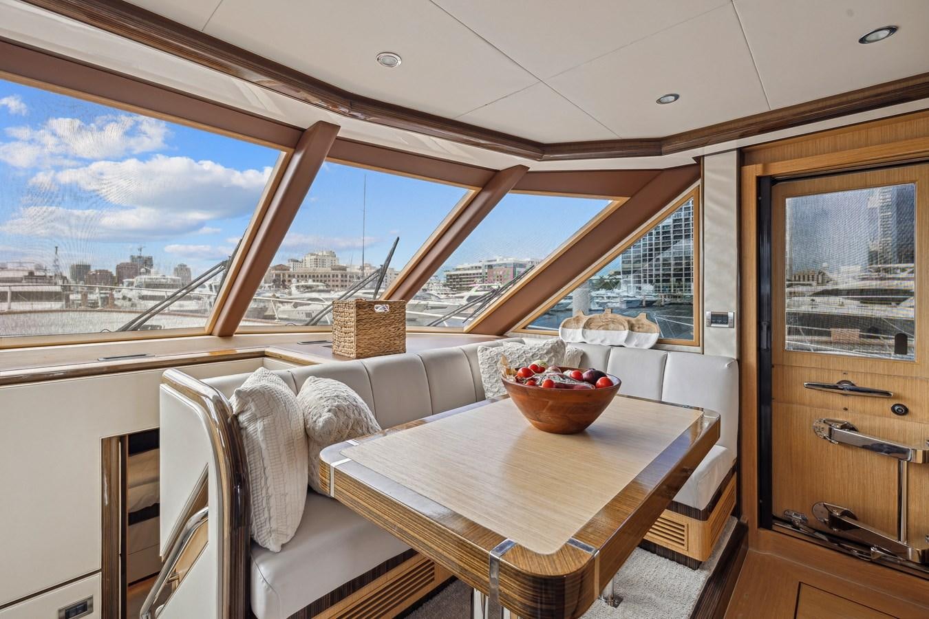 a table and chairs in a room aboard O A Yacht for Sale