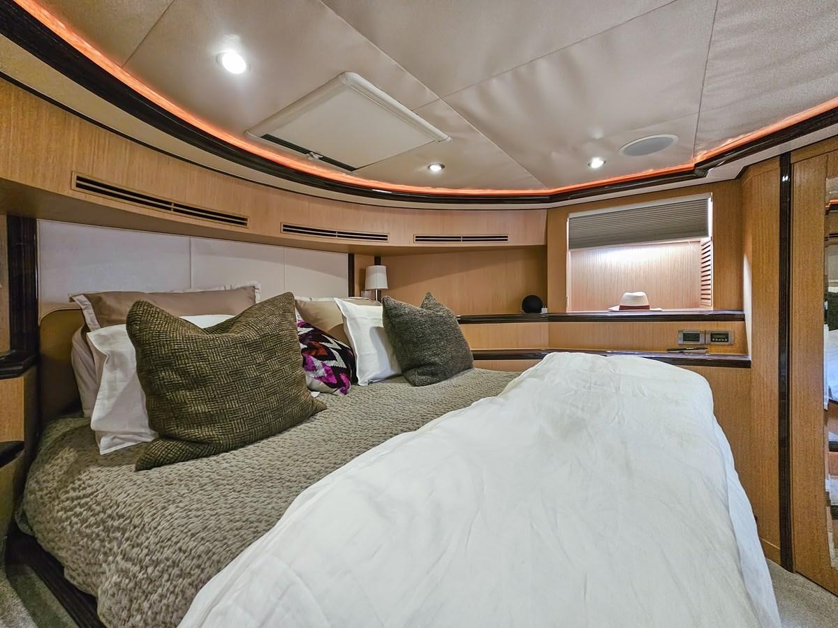 a bed with pillows aboard O A Yacht for Sale